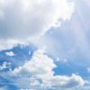 white fluffy clouds on blue sky in summer on sunny day. Beautiful cloudscape background